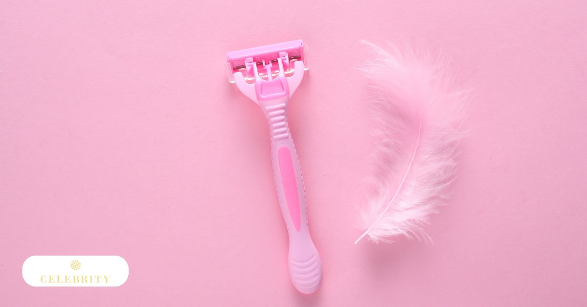 A pink disposable razor and a soft pink feather on a matching background, illustrating shaving, a safe option for removing nipple hairs