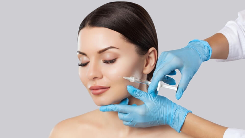 Doctor cosmetologist makes rejuvenating facial Botox
