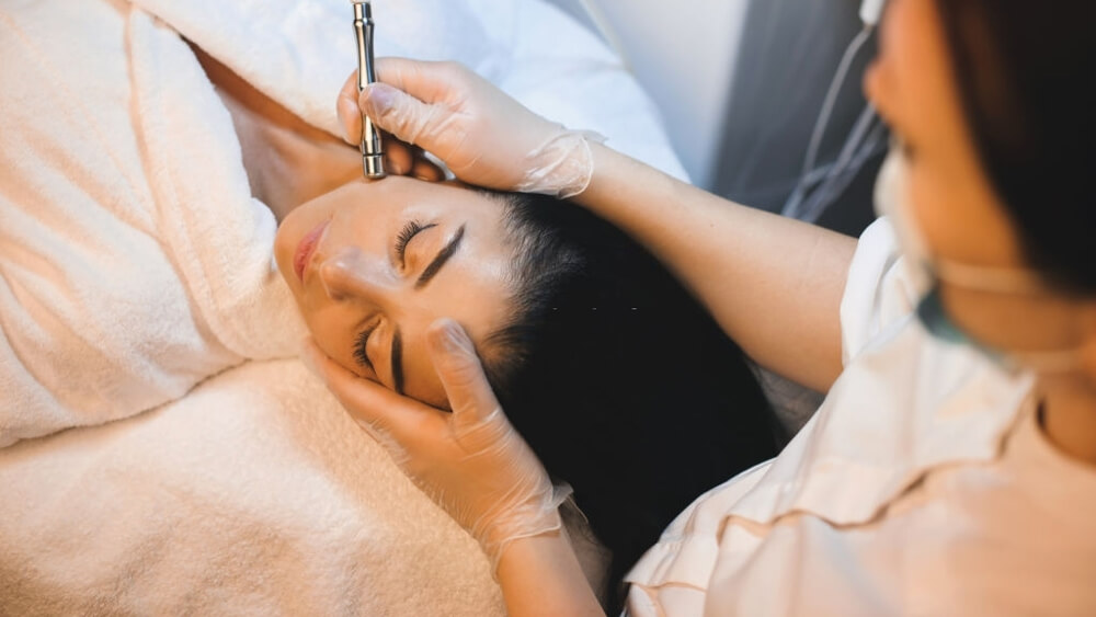 A woman have microdermabrasion treatment for sagging skin