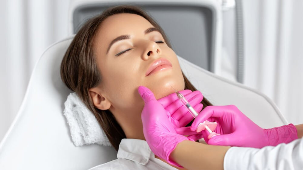 Woman at the beautician cosmetologist does anti wrinkle treatment