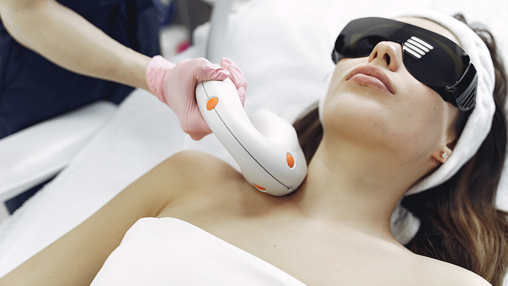 Woman in beauty salon under laser hair removal process