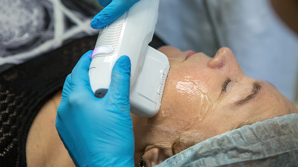A woman taking IPL treatment for rejuvenating her skin