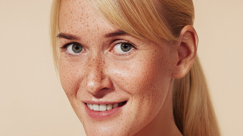 Nice woman with freckles on her face