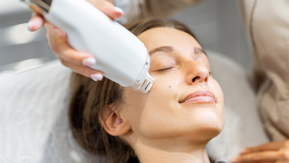 Woman during a laser rejuvenation treatment on her face