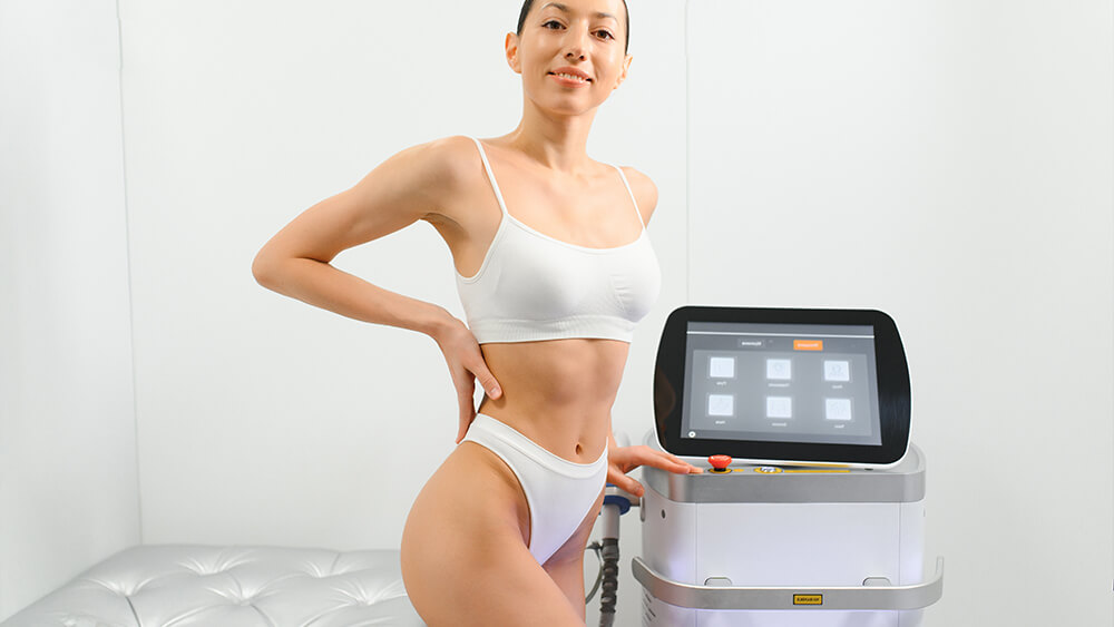 Happy woman near the laser hair removal machine