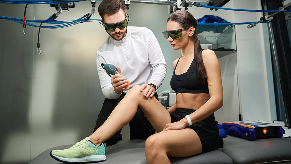 Young female athlete under laser hair removal treatment