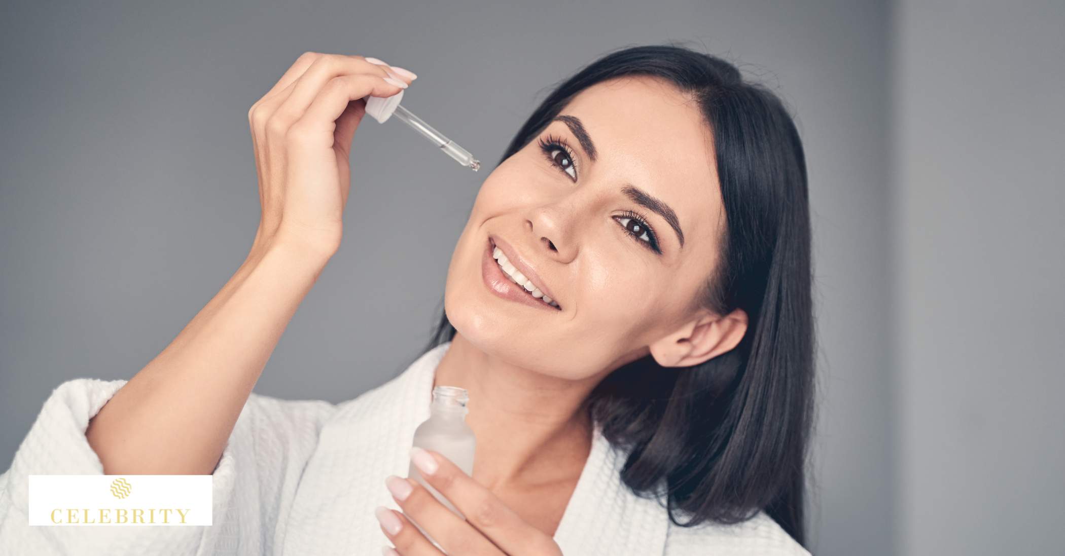  An image of a woman holding a serum and applying it to her skin.