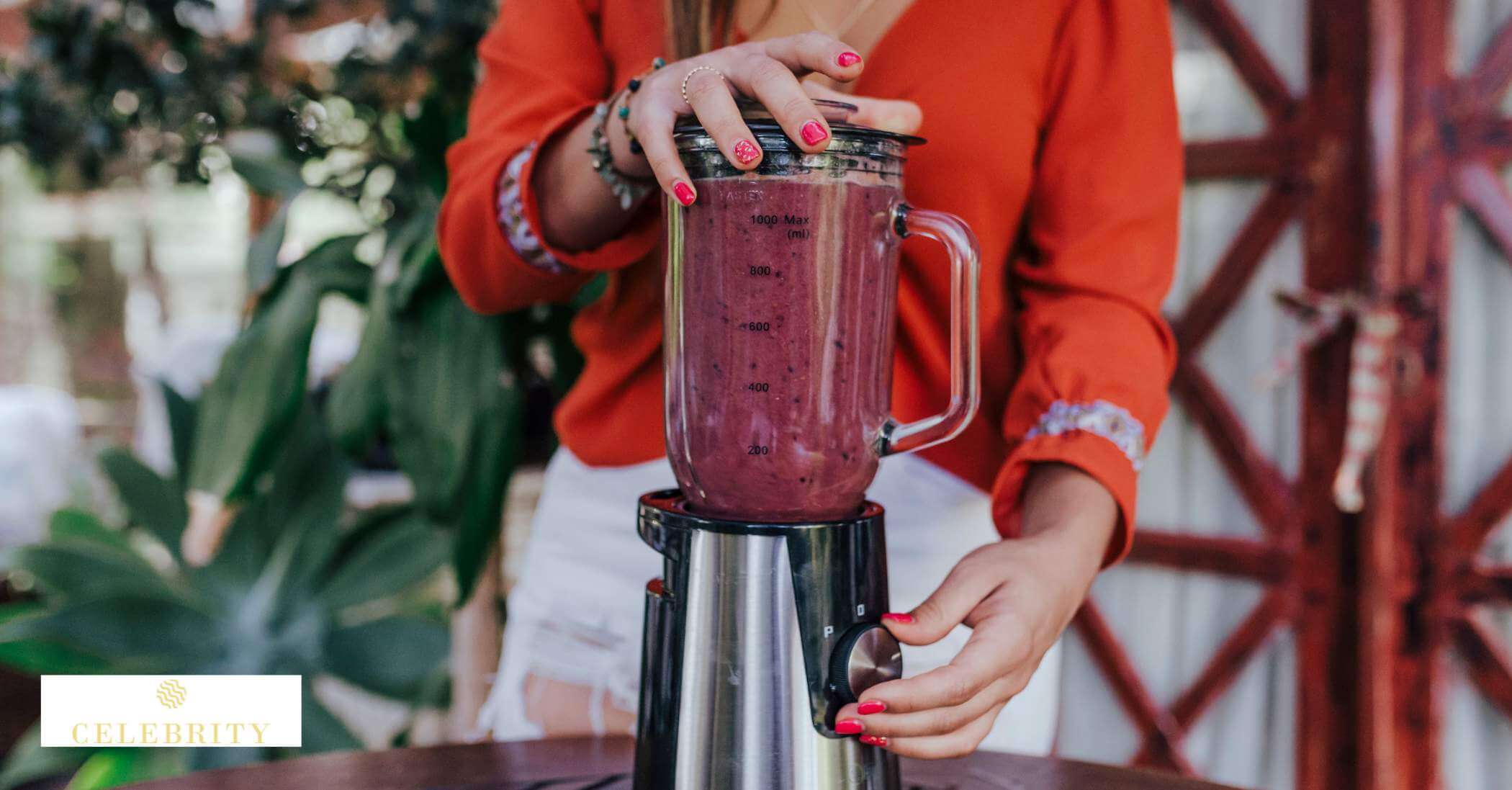 A woman prepares fresh fruits and vegetables in a blender, promoting healthy habits for enhanced collagen production