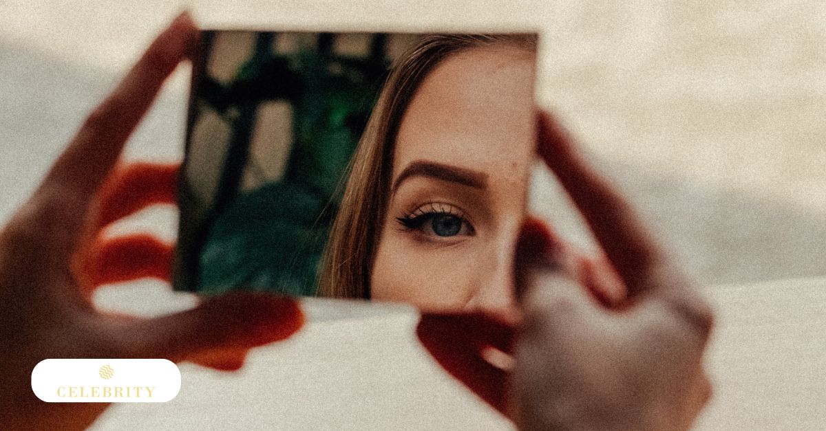 A woman checking at her reflection in the mirror, showcasing her eyeliner microblading aftercare results