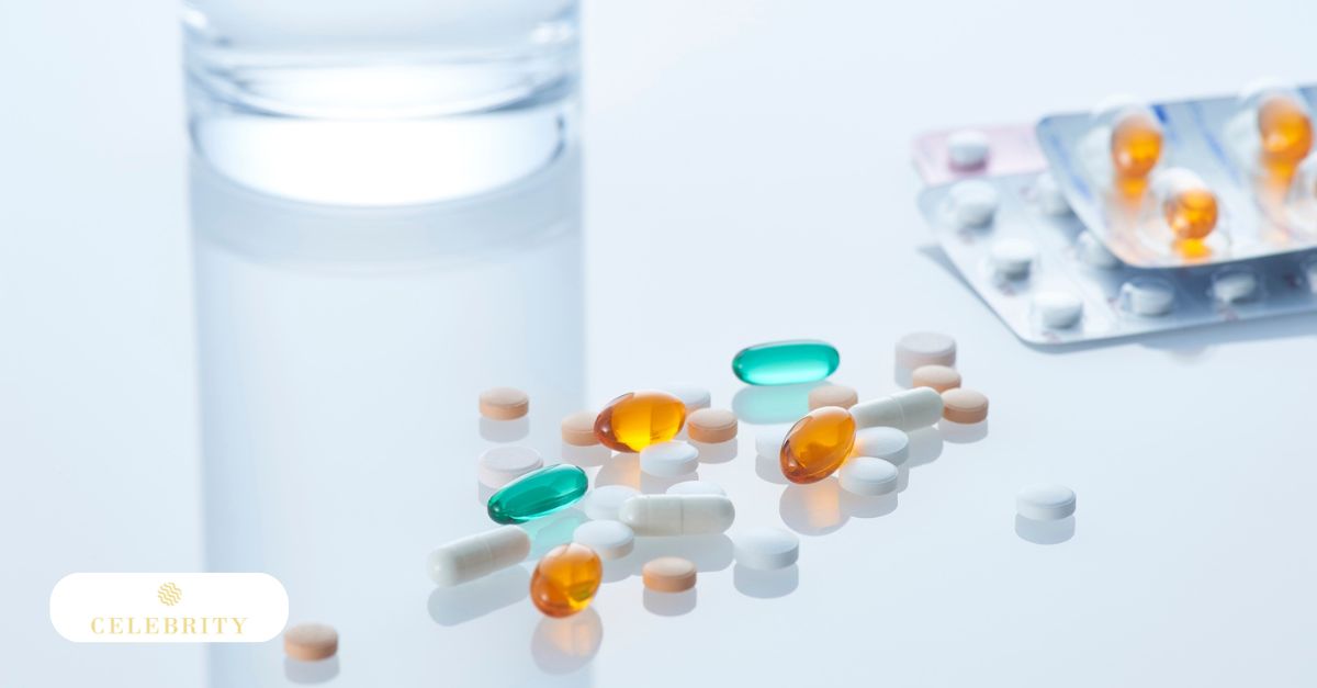 An assortment of capsules and tablets are scattered on a bright surface next to a glass of water, highlighting the use of oral medications for hair growth.