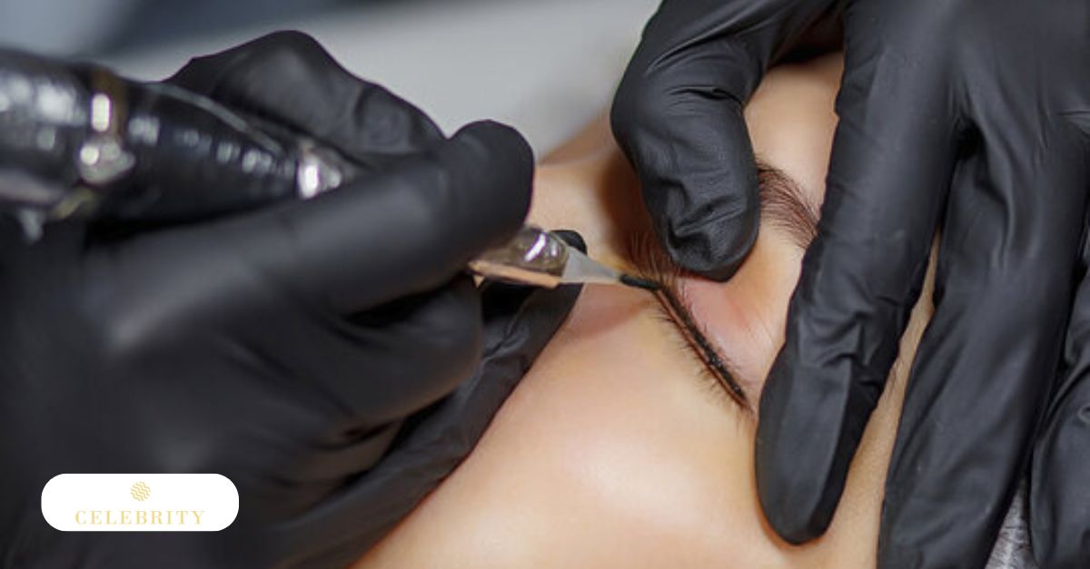 A technician applying precision pigment to a client's eyelid during a professional eyeliner microblading session.