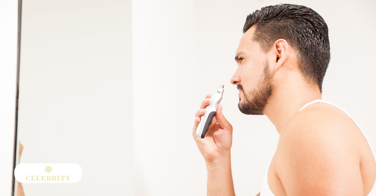  A man trims his hair with a hair trimmer, emphasizing the importance of hair growth treatments