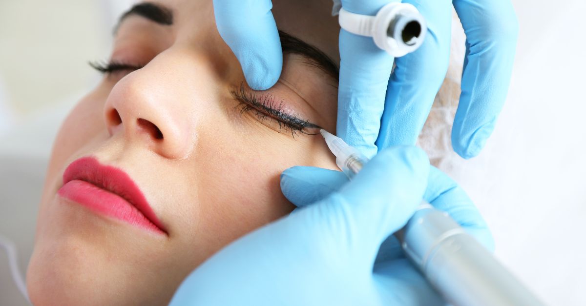 A woman undergoing eyeliner microblading
