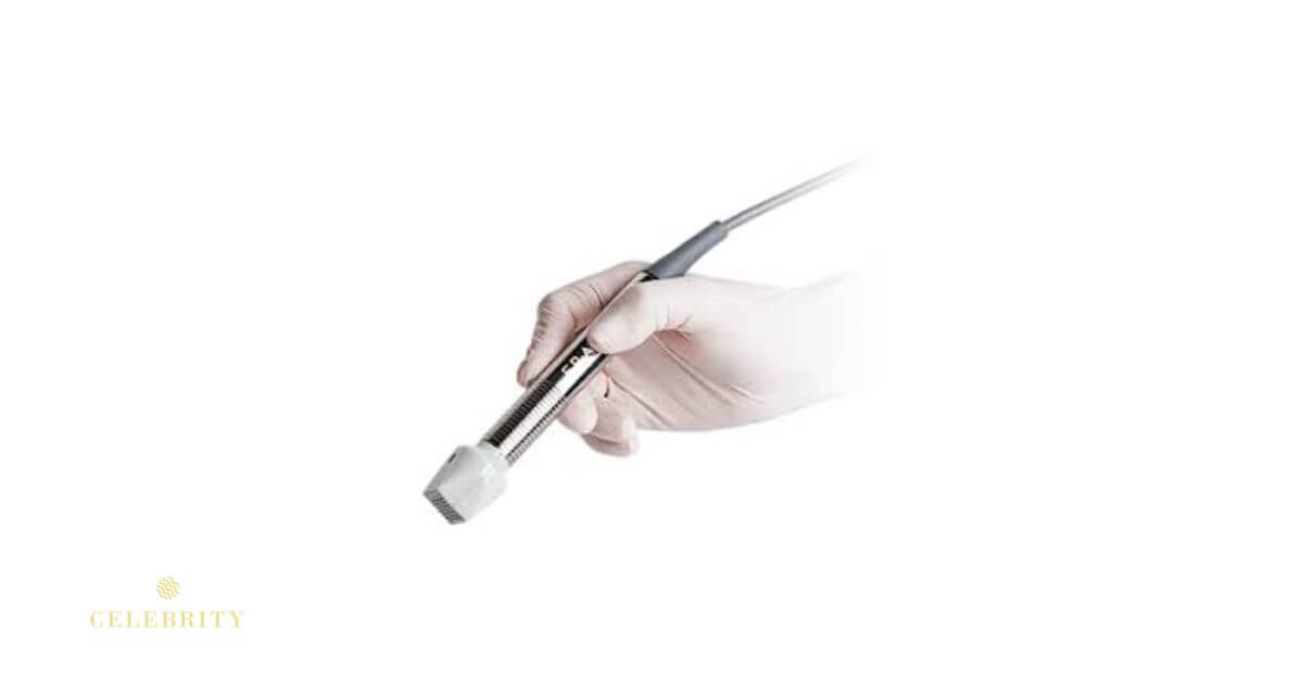 A hand holds a Votiva vaginal rejuvenation device