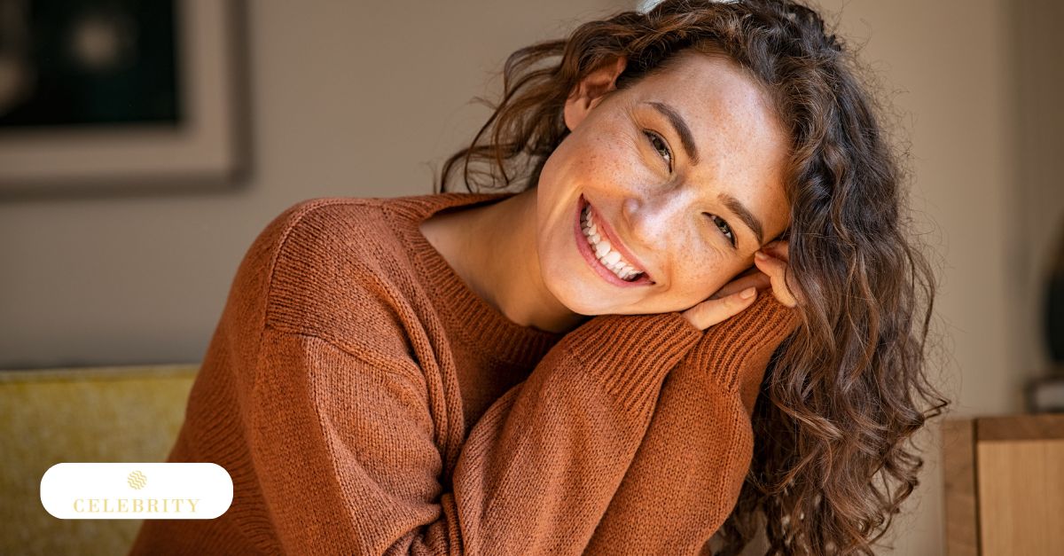 A woman smiles brightly, benefiting from skincare that enhances tone, texture, and overall skin health with consistency.