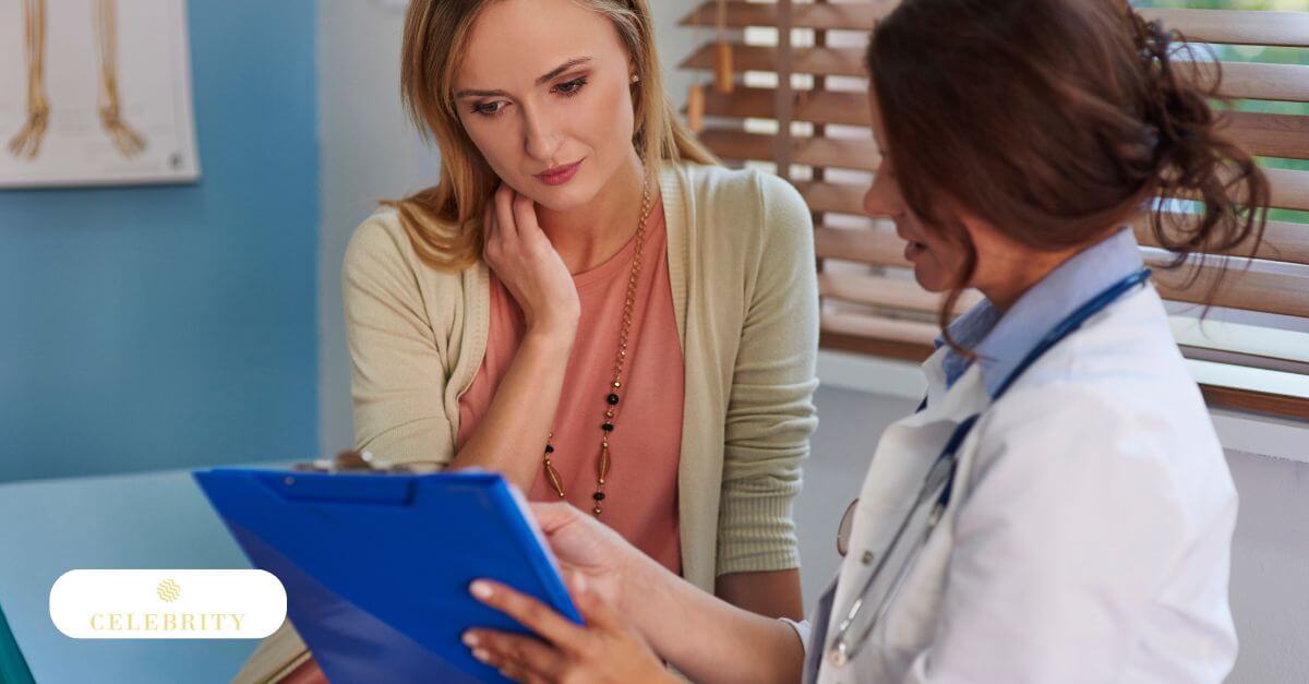 A woman is looking at a chart comparing treatment options in a doctor's office.