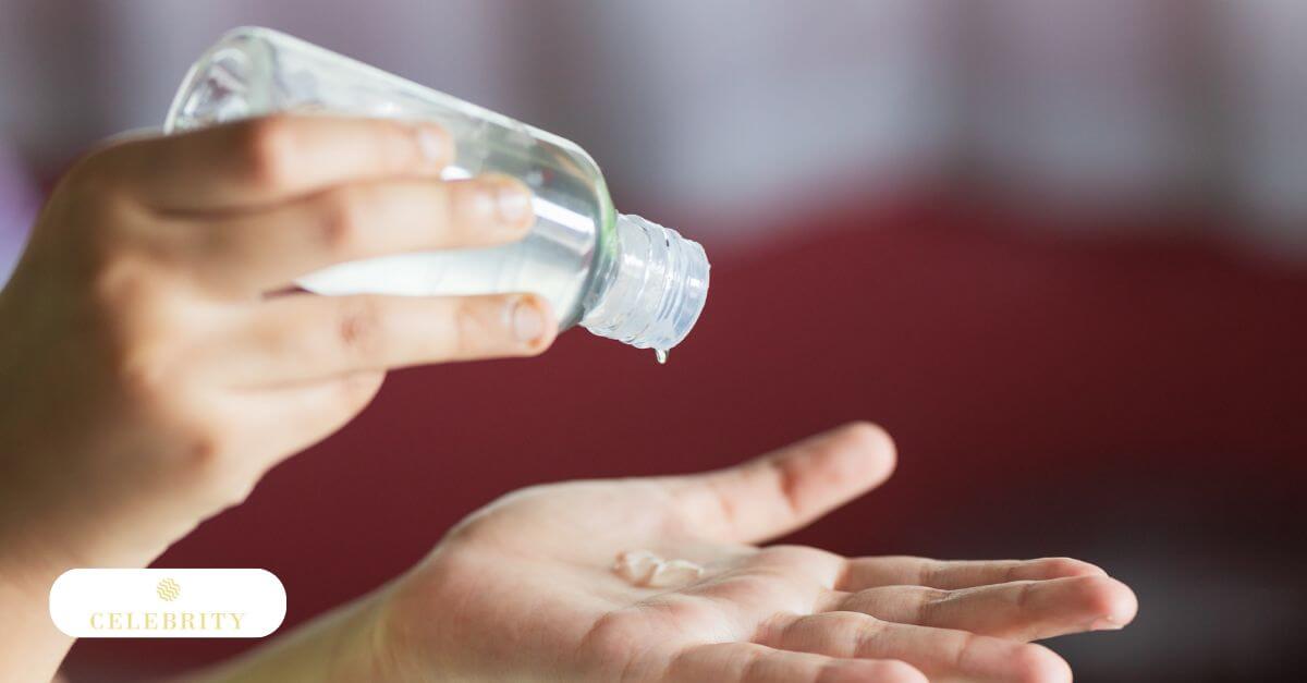 A woman’s hand gently holds a tube of vaginal moisturizer
