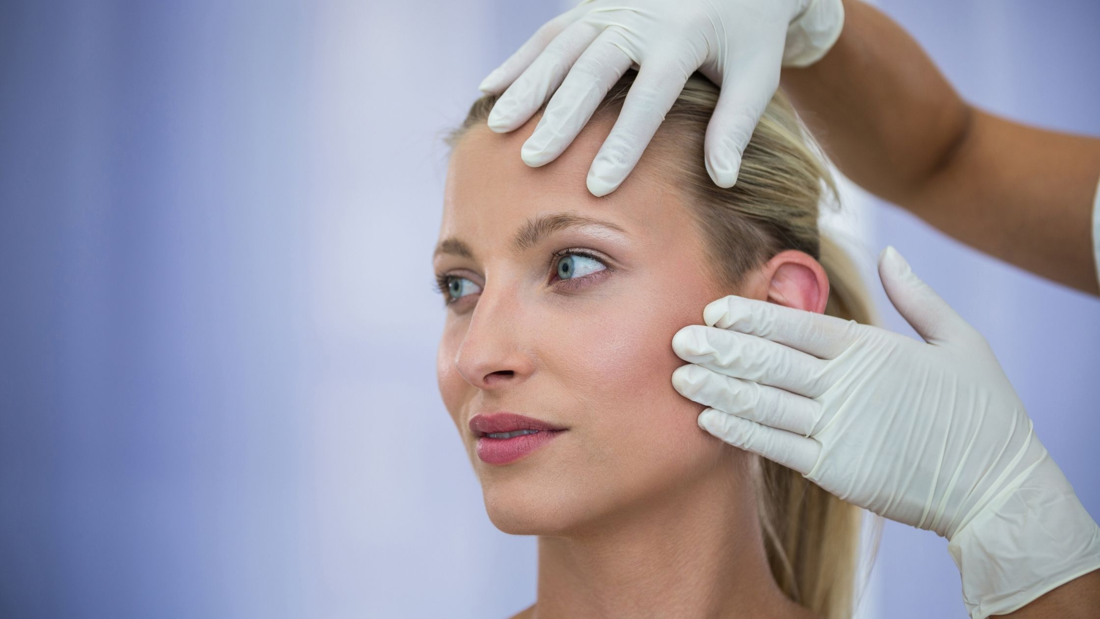 Botox vs Dysport Decision. A woman thinking with a doctors hand on her face?