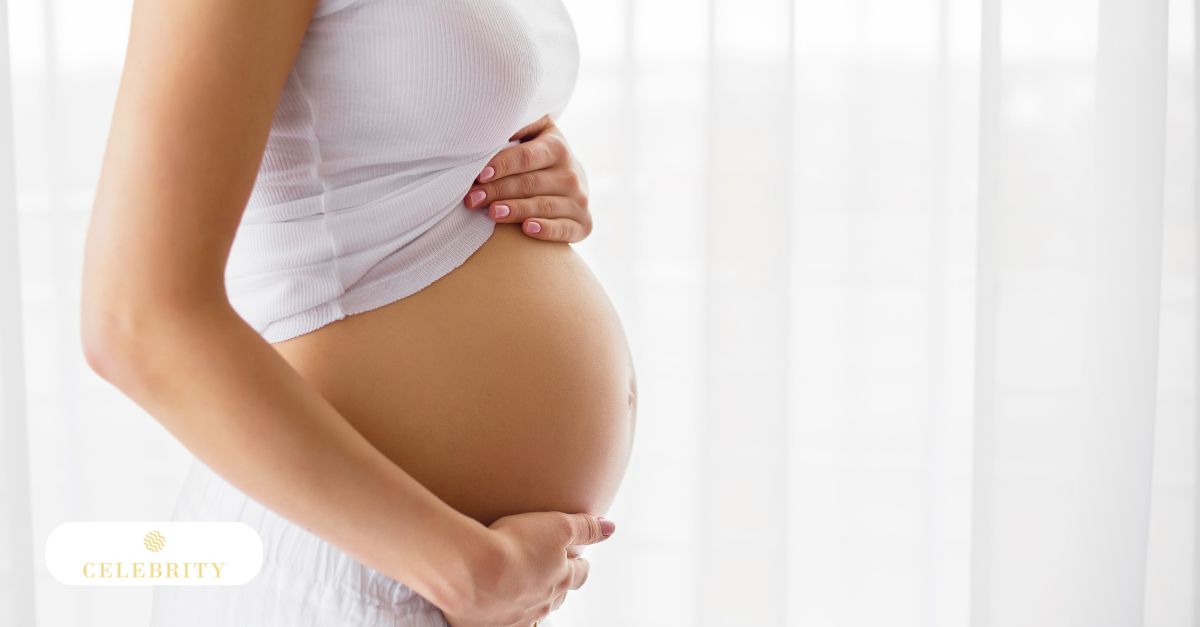 Pregnant woman resting with hands on her belly, illustrating considerations around laser hair removal during pregnancy.