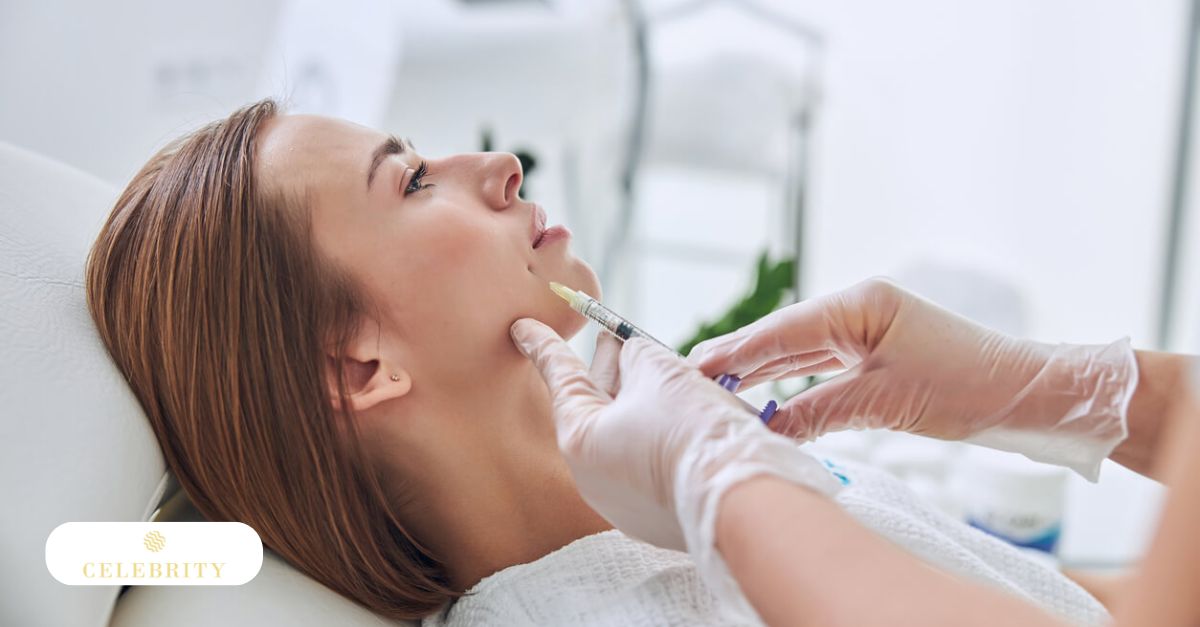 Cosmetic professional administering dermal filler injection to reduce visible smile lines around woman&rsquo;s mouth.